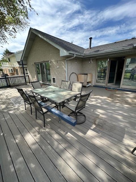 8005 W 143rd Pl, Orland Park, IL 60462 - wooden deck with outdoor dining space