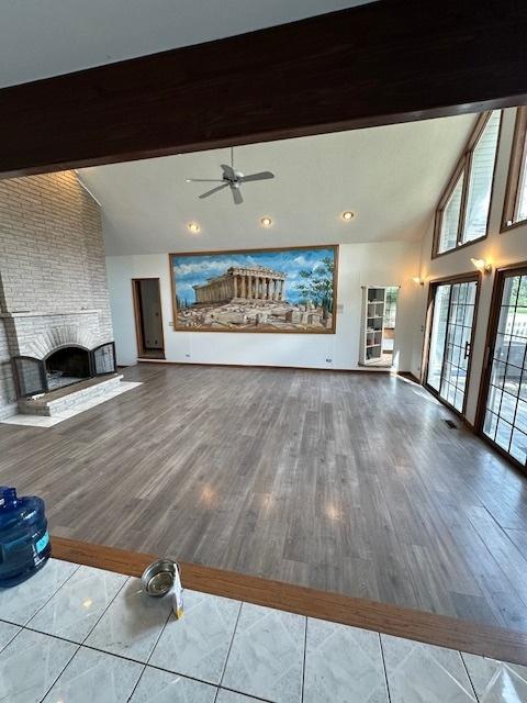 8005 W 143rd Pl, Orland Park, IL 60462 - unfurnished living room with a brick fireplace, ceiling fan, and wood finished floors
