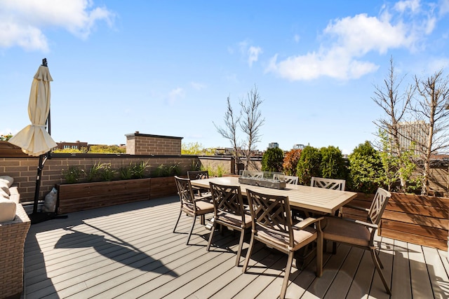 wooden deck with outdoor dining area