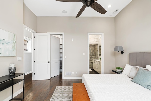 bedroom featuring dark wood-style flooring, baseboards, connected bathroom, and a ceiling fan