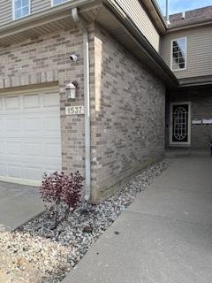 view of property exterior with brick siding