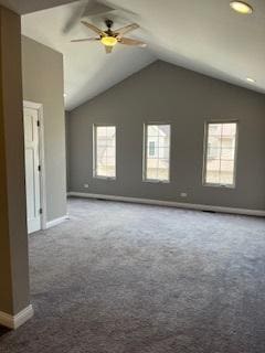 spare room with a ceiling fan, baseboards, dark colored carpet, and lofted ceiling