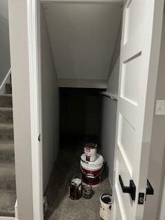stairway with lofted ceiling