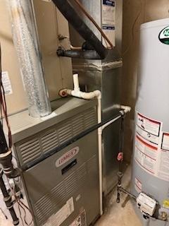 utilities featuring gas water heater and heating unit
