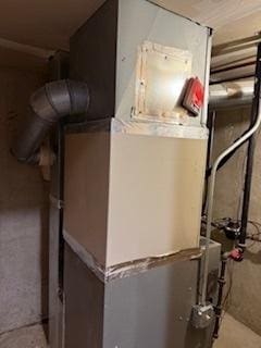 utility room with heating unit