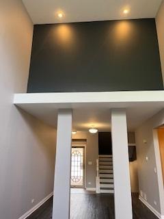 interior space with wood finished floors, baseboards, and recessed lighting