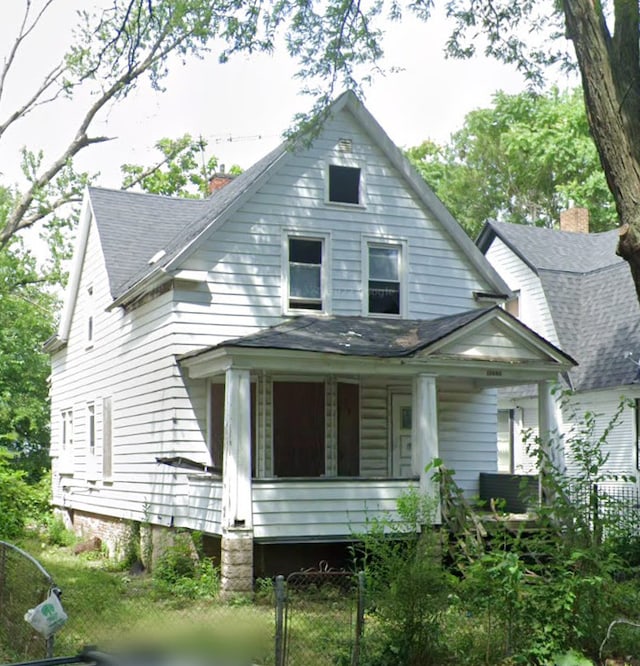 back of house featuring covered porch