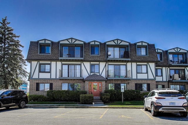 116 Steeple Dr Unit E, Buffalo Grove, IL 60089 - multi unit property featuring uncovered parking, brick siding, and mansard roof
