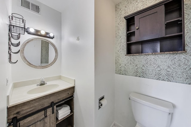 116 Steeple Dr Unit E, Buffalo Grove, IL 60089 - half bathroom featuring toilet and vanity