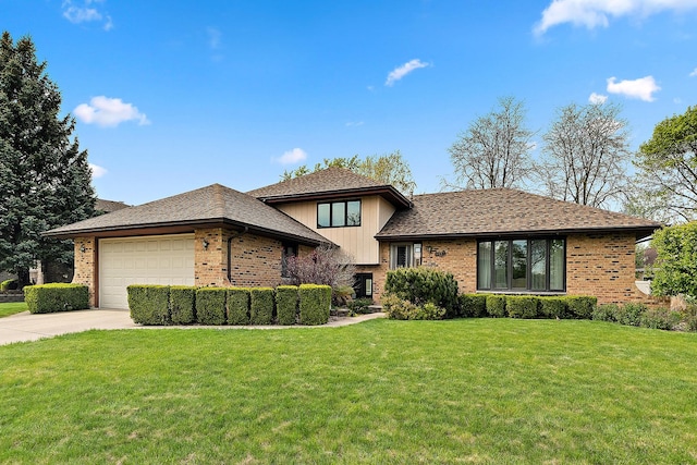 8120 Cherokee Trl, Tinley Park, IL 60477 - split level home featuring brick siding, an attached garage, concrete driveway, and a front yard