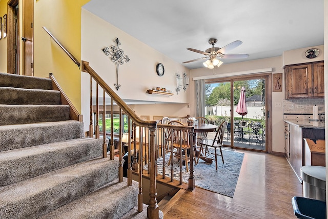 8120 Cherokee Trl, Tinley Park, IL 60477 - dining space featuring a ceiling fan, stairway, light wood finished floors, and baseboards