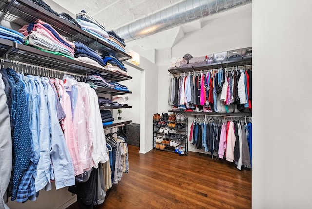 walk in closet featuring wood finished floors