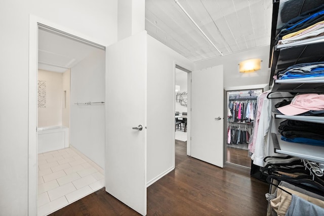 spacious closet with wood finished floors