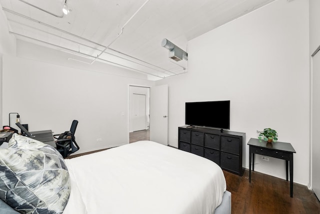 bedroom featuring wood finished floors