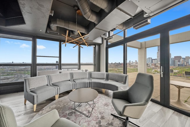 sunroom / solarium featuring a city view