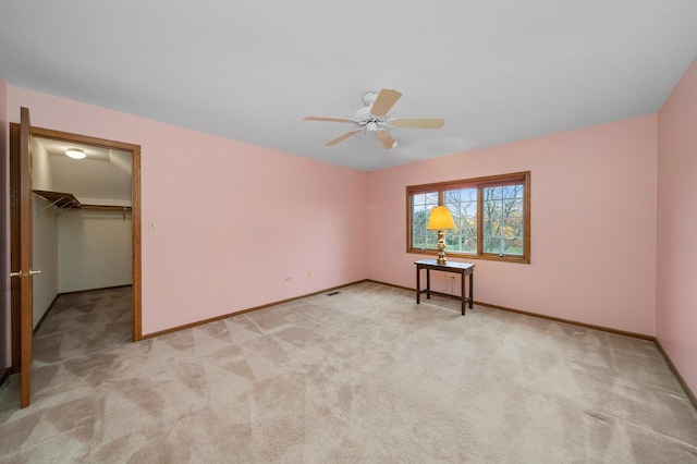 631 Indian Trail Dr, Palos Park, IL 60464 - unfurnished bedroom featuring light carpet, a walk in closet, baseboards, and a closet