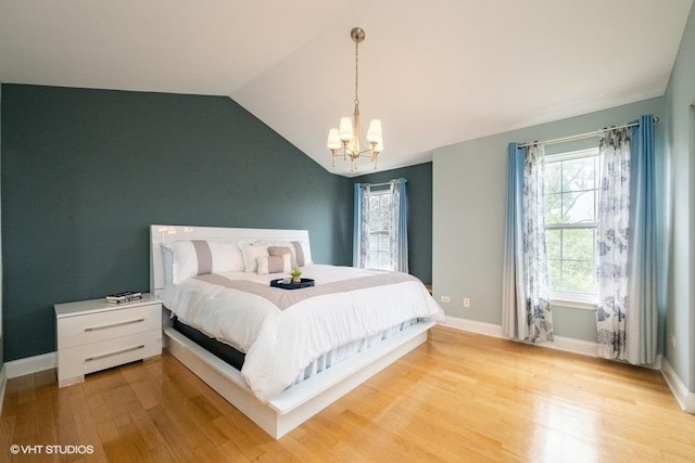 1788 Nature Ct, Schaumburg, IL 60193 - bedroom featuring a chandelier, light wood-style floors, vaulted ceiling, and baseboards
