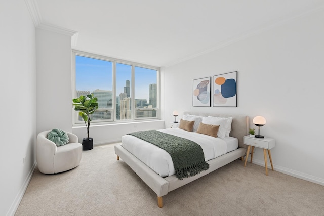 bedroom with ornamental molding, baseboards, carpet floors, and a view of skyline