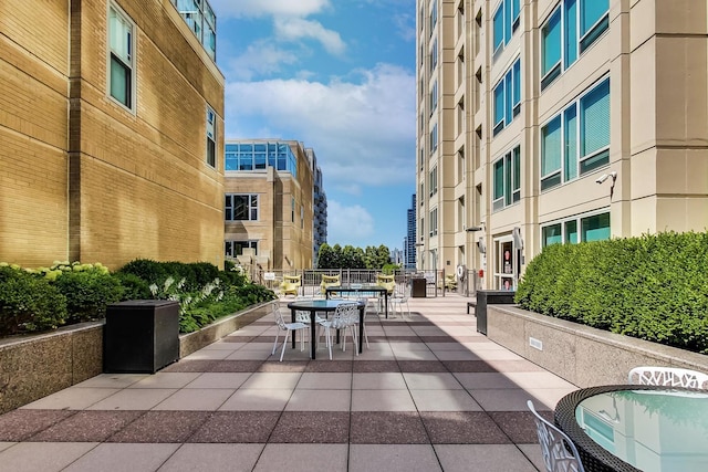 view of community with outdoor dining space
