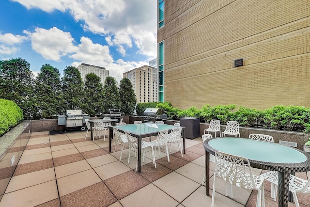 view of patio / terrace with outdoor dining area, area for grilling, and grilling area