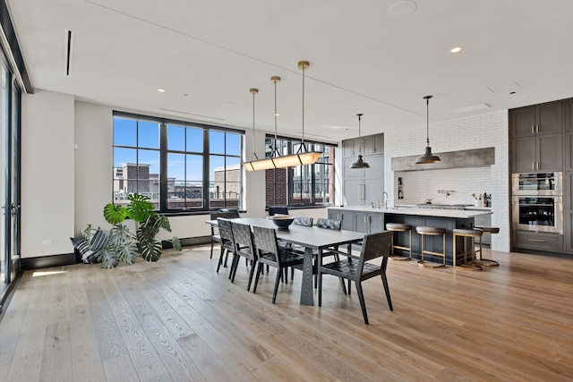 1109 W Washington Blvd Unit 5C, Chicago, IL 60607 - dining space featuring light wood-type flooring, recessed lighting, and baseboards