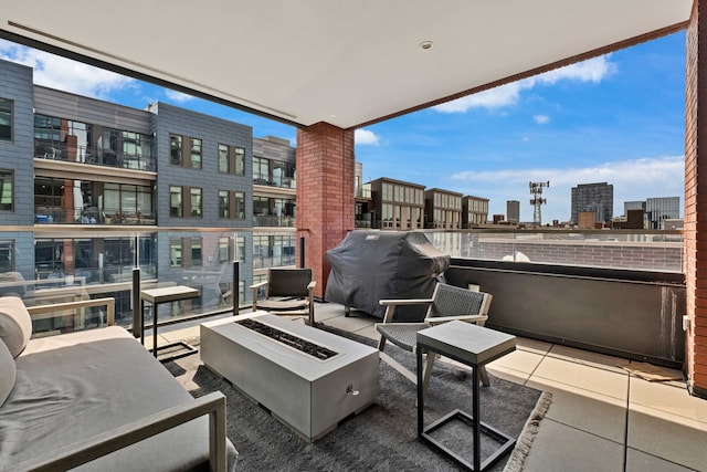1109 W Washington Blvd Unit 5C, Chicago, IL 60607 - view of patio with an outdoor fire pit, a balcony, grilling area, and a city view