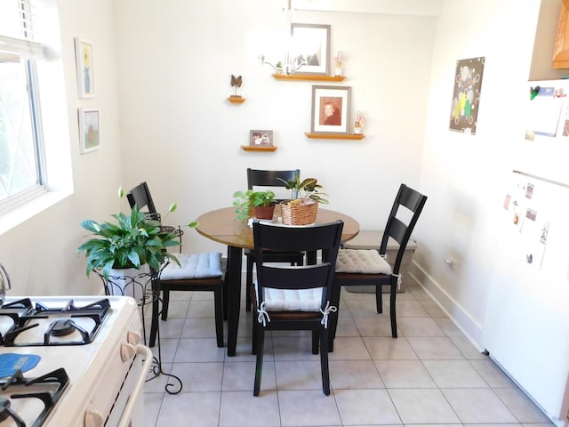 17242 71st Ct Unit 4, Tinley Park, IL 60477 - dining area featuring light tile patterned flooring and baseboards
