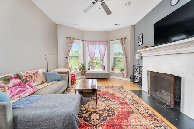 908 W Lakeside Pl Unit 3W, Chicago, IL 60640 - living area featuring wood finished floors, ceiling fan, and a brick fireplace