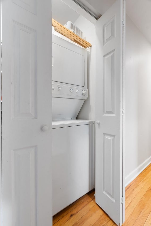 908 W Lakeside Pl Unit 3W, Chicago, IL 60640 - laundry room with stacked washer and clothes dryer and light wood finished floors