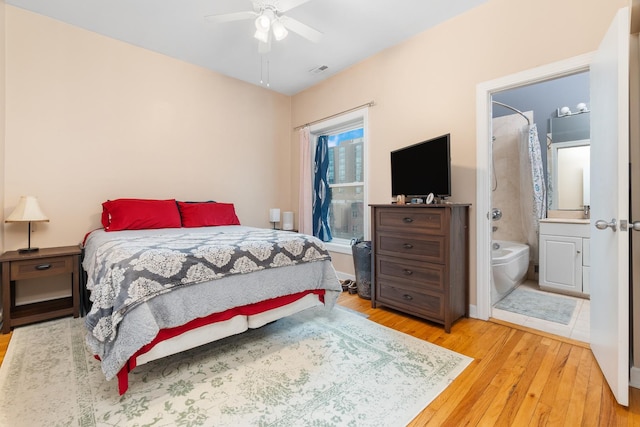 908 W Lakeside Pl Unit 3W, Chicago, IL 60640 - bedroom with wood-type flooring, ensuite bathroom, and ceiling fan