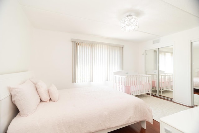 8560 W Foster Ave Unit 209, Norridge, IL 60706 - bedroom with dark wood-type flooring and multiple closets