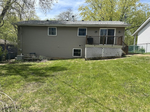 back of house with a wooden deck and central AC