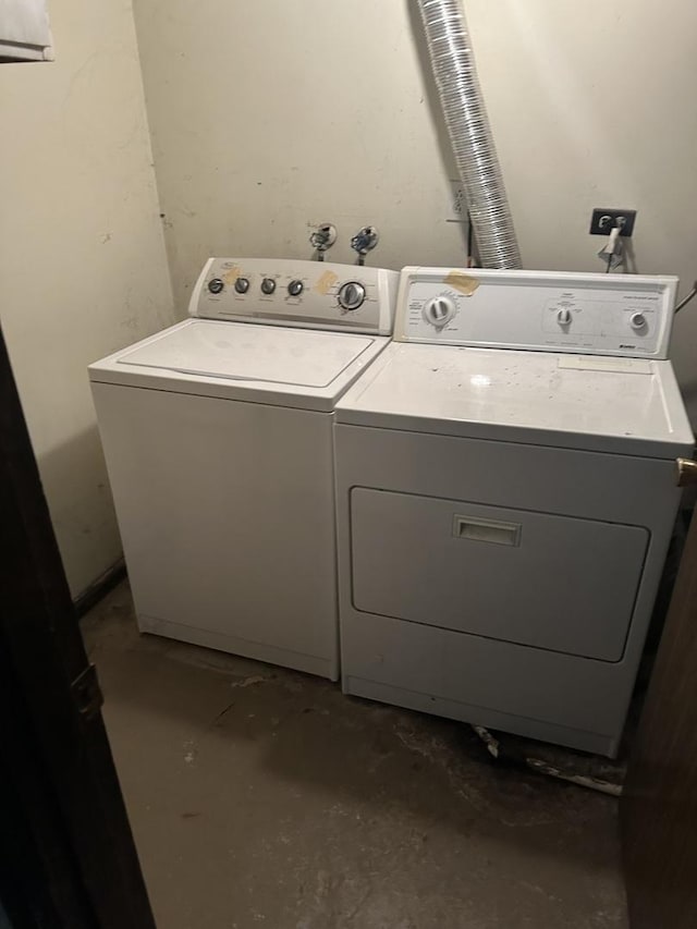 clothes washing area featuring washer and dryer