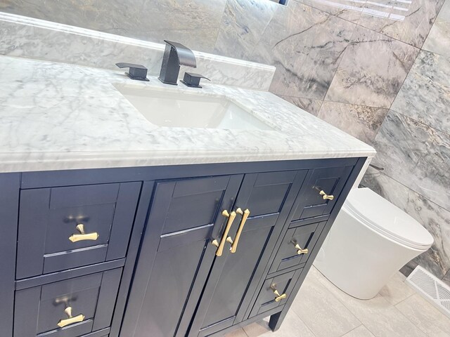 76 E Craig Dr, Chicago Heights, IL 60411 - bathroom with vanity, tile walls, and toilet