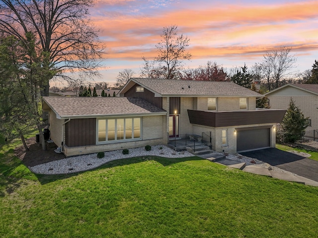 6709 W Menominee Pkwy, Palos Heights, IL 60463 - view of front of home with brick siding, asphalt driveway, roof with shingles, and a yard