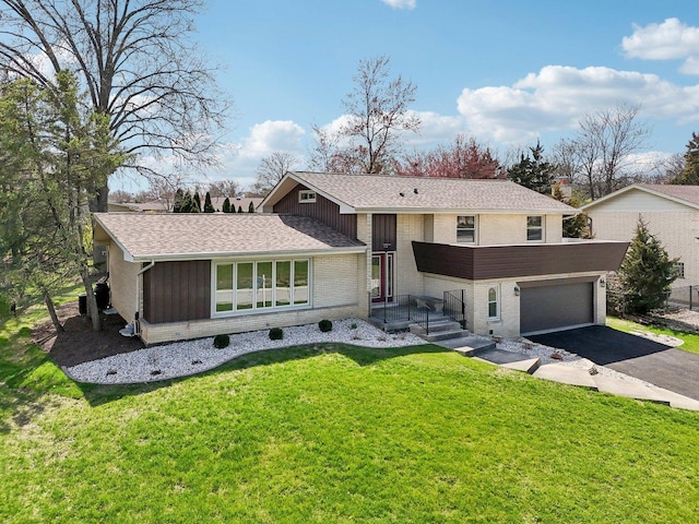 6709 W Menominee Pkwy, Palos Heights, IL 60463 - split level home with asphalt driveway, brick siding, a front lawn, a garage, and a shingled roof