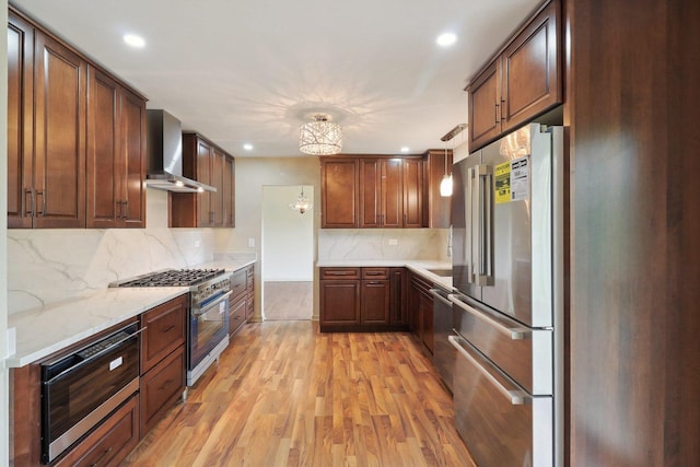 6709 W Menominee Pkwy, Palos Heights, IL 60463 - kitchen with premium appliances, wall chimney exhaust hood, light wood-type flooring, recessed lighting, and decorative backsplash