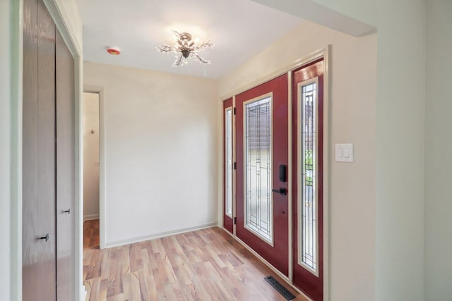 6709 W Menominee Pkwy, Palos Heights, IL 60463 - foyer with light wood-type flooring and baseboards