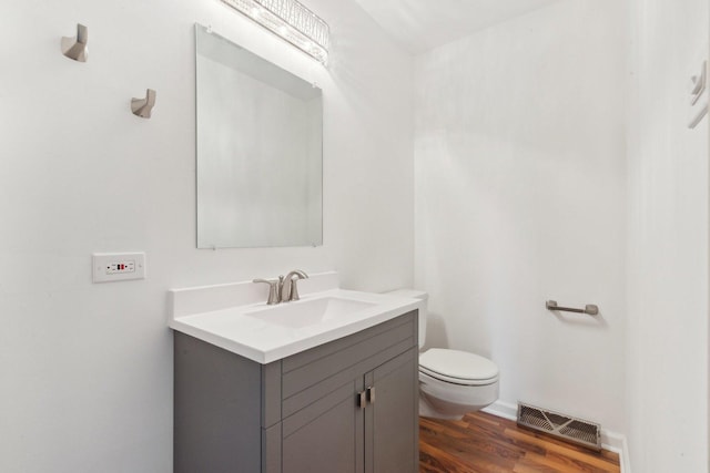 6709 W Menominee Pkwy, Palos Heights, IL 60463 - half bathroom with toilet, wood finished floors, and vanity