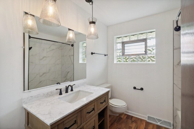 6709 W Menominee Pkwy, Palos Heights, IL 60463 - full bath with toilet, wood finished floors, vanity, a shower, and baseboards