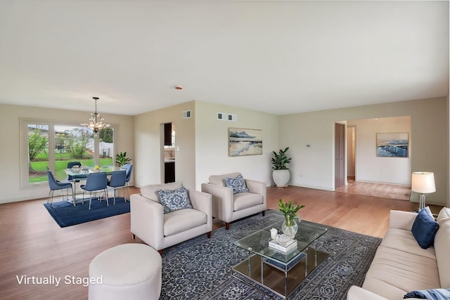 6709 W Menominee Pkwy, Palos Heights, IL 60463 - living room with a chandelier, wood finished floors, and baseboards