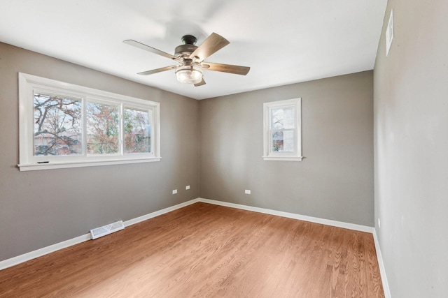 6709 W Menominee Pkwy, Palos Heights, IL 60463 - spare room with plenty of natural light, light wood-type flooring, baseboards, and ceiling fan