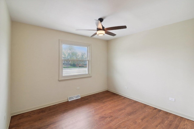 6709 W Menominee Pkwy, Palos Heights, IL 60463 - empty room featuring ceiling fan, wood finished floors, and baseboards