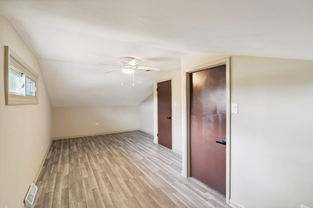 6709 W Menominee Pkwy, Palos Heights, IL 60463 - bonus room with lofted ceiling, light wood finished floors, a ceiling fan, and baseboards