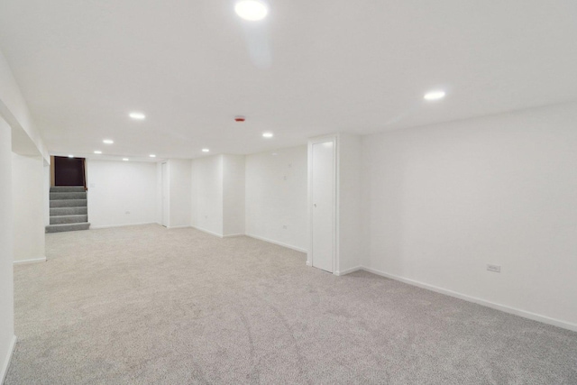 6709 W Menominee Pkwy, Palos Heights, IL 60463 - finished basement with light colored carpet, recessed lighting, stairway, and baseboards