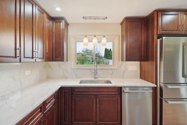 6709 W Menominee Pkwy, Palos Heights, IL 60463 - kitchen featuring stainless steel appliances, a sink, light stone countertops, hanging light fixtures, and backsplash