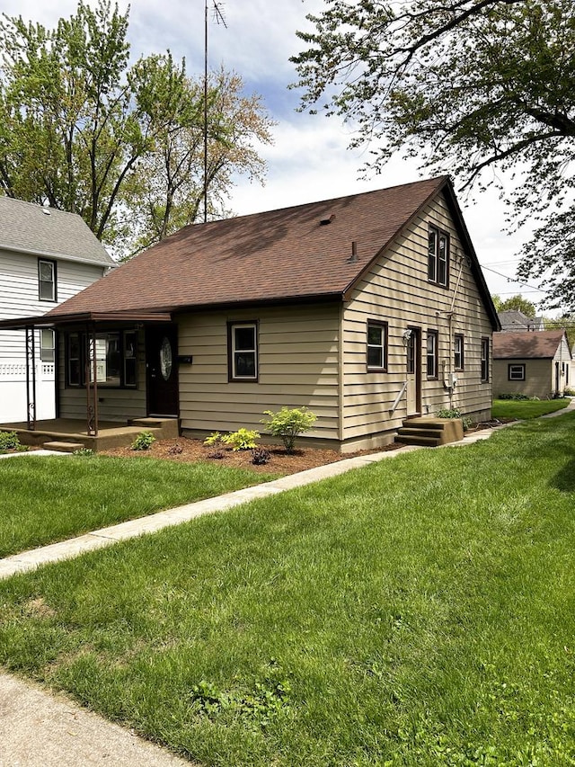 384 N Grand Ave, Bradley, IL 60915 - view of front of property with a front yard and a shingled roof