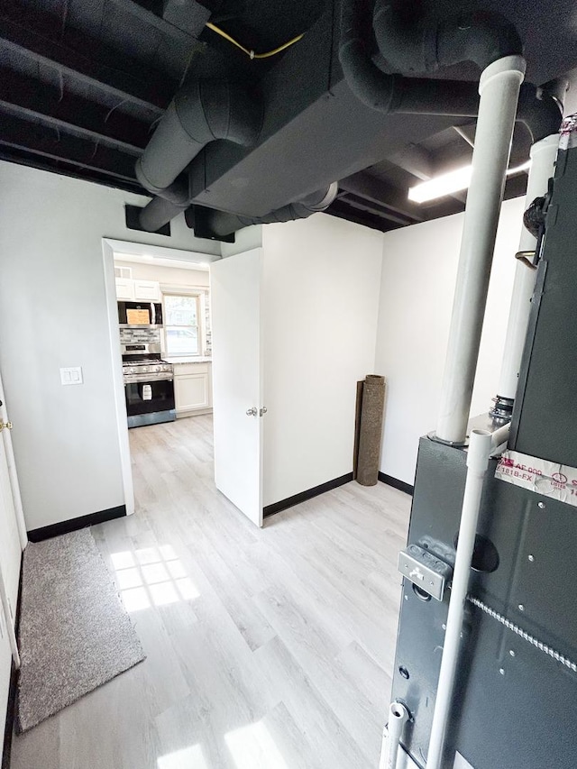 384 N Grand Ave, Bradley, IL 60915 - basement with light wood-style flooring and baseboards