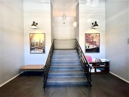 staircase featuring baseboards