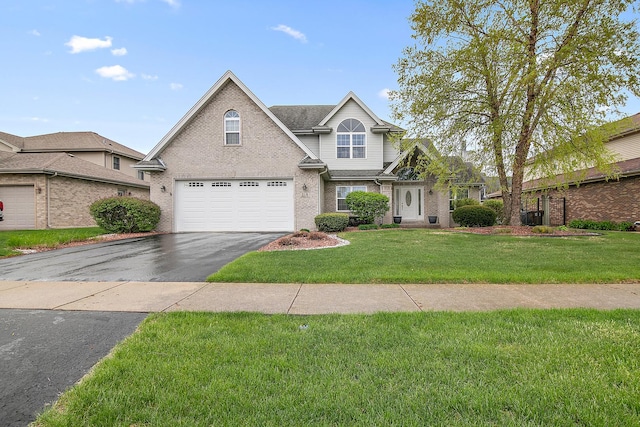 318 Maple St, Beecher, IL 60401 - traditional-style house with asphalt driveway, a garage, a front lawn, and brick siding